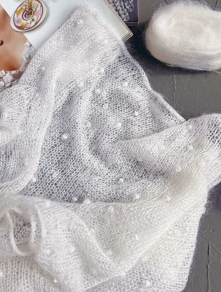 Cloud on needles. Knitting with fluffy yarn